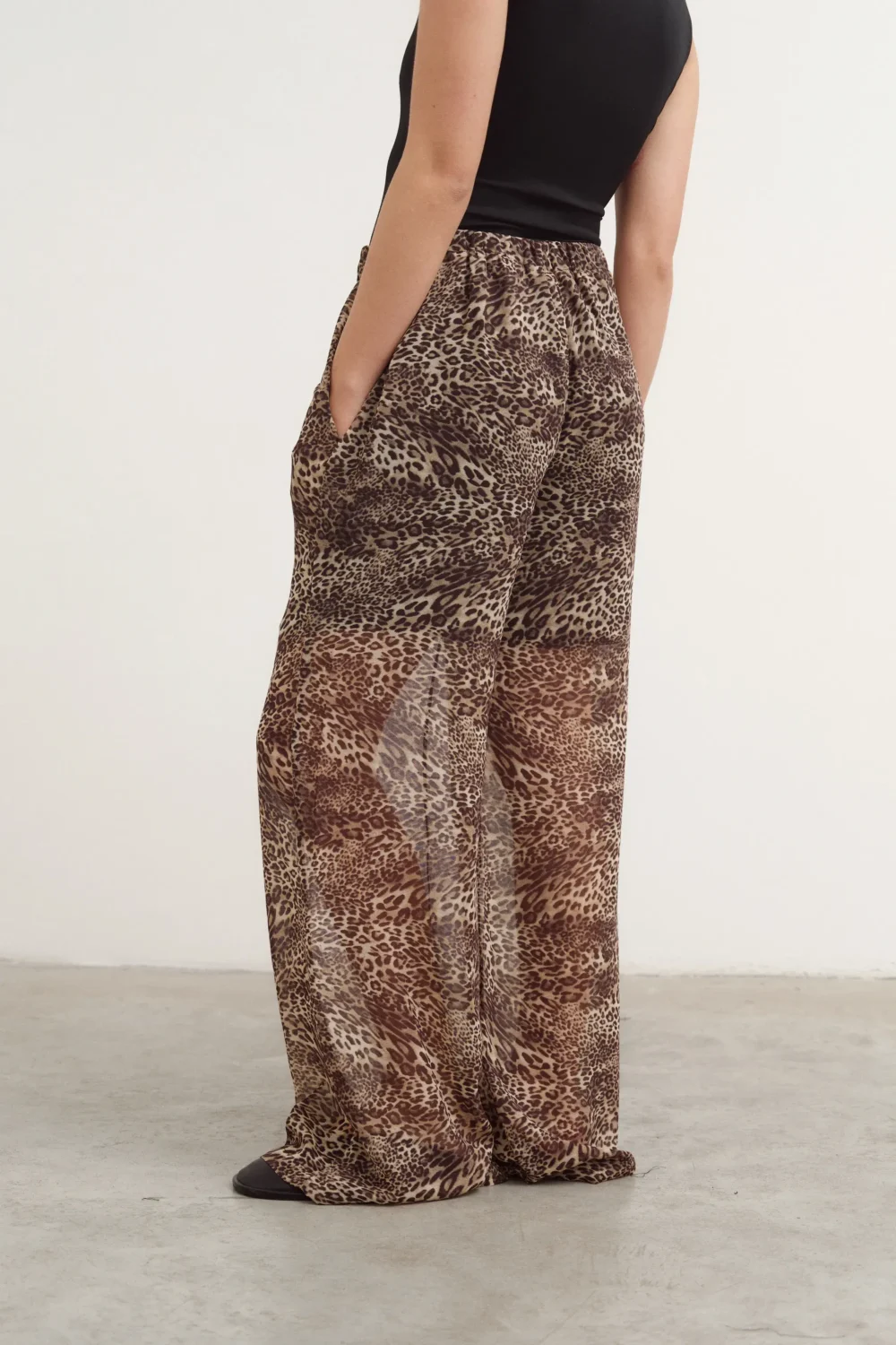 Pantalon sport sectionné à quatre bandes